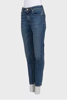 Straight-leg blue jeans with a distressed effect