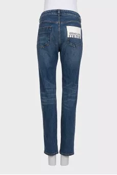 Straight-leg blue jeans with a distressed effect