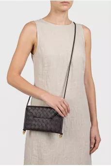 Woven leather bag with a thin strap