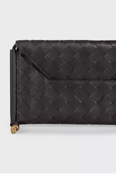 Woven leather bag with a thin strap