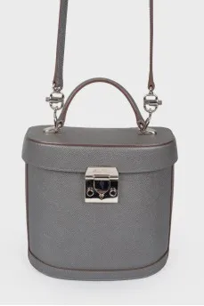 Grey leather bag with silver clasp, red leather inside