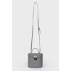 Grey leather bag with silver clasp, red leather inside