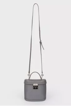 Grey leather bag with silver clasp, red leather inside