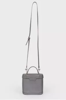 Grey leather bag with silver clasp, red leather inside