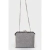 Silver shiny clutch on a chain