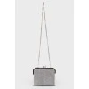 Silver shiny clutch on a chain