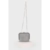 Silver shiny clutch on a chain