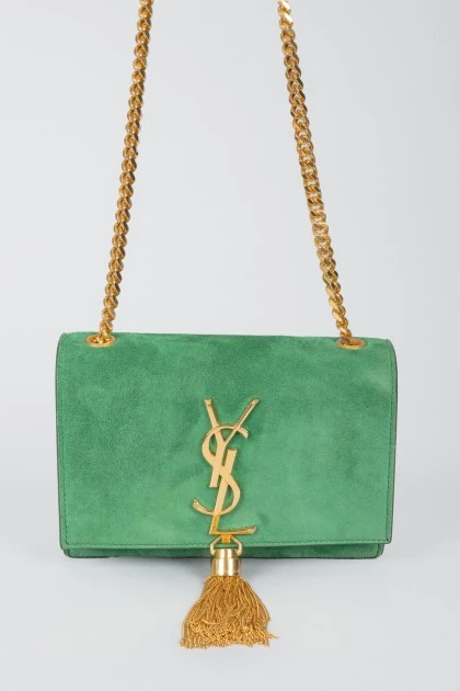 Green sued handbag with golden fittings, on the button