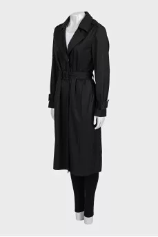 Fitted black coat with a belt