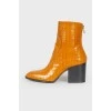Leather square toe booties with a tag