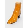 Leather square toe booties with a tag