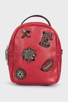 Red leather backpack with decor