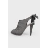 Sandals with a bow on the heel