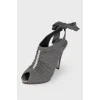 Sandals with a bow on the heel