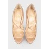 Varnished leather shoes on a high stilettos with a tag