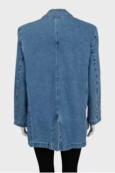 Blue denim jacket with a brooch