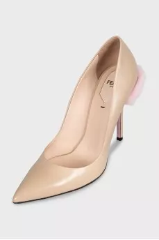 Beige leather pumps with fur trim