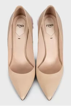 Beige leather pumps with fur trim