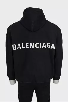 Men's black loose-fitting hoodie with brand logo