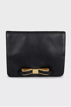 Black leather clutch with a bow