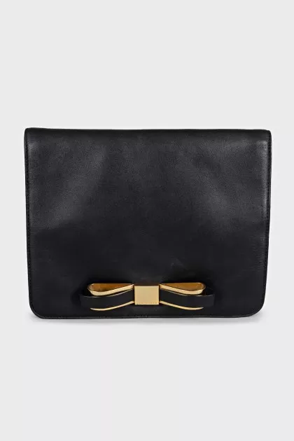 Black leather clutch with a bow