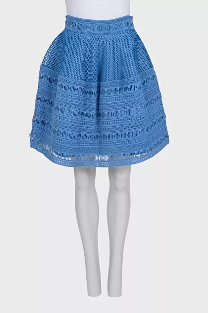 The blue skirt is decorated with drapery
