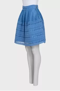 The blue skirt is decorated with drapery