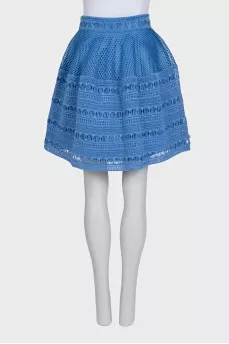 The blue skirt is decorated with drapery