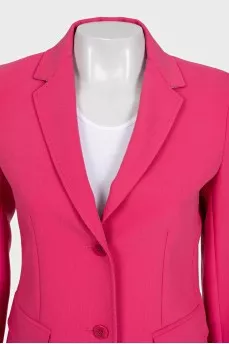 A suit consisting of a fitted jacket and cropped trousers