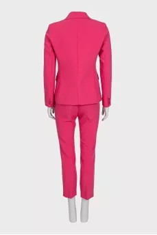 A suit consisting of a fitted jacket and cropped trousers