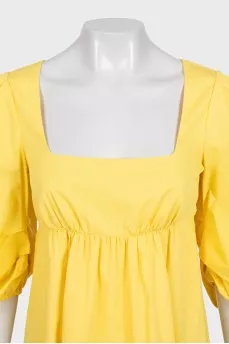 Fitted yellow dress with long sleeves