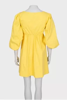 Fitted yellow dress with long sleeves