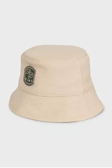 Beige panama hat decorated with a patch