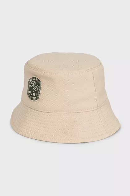 Beige panama hat decorated with a patch