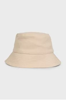Beige panama hat decorated with a patch