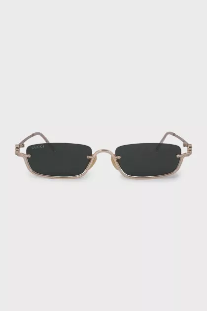 Narrow sunglasses with green tint