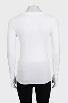 White long sleeve top with thumb holes
