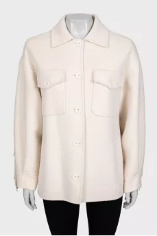 Short wool coat decorated with fringe