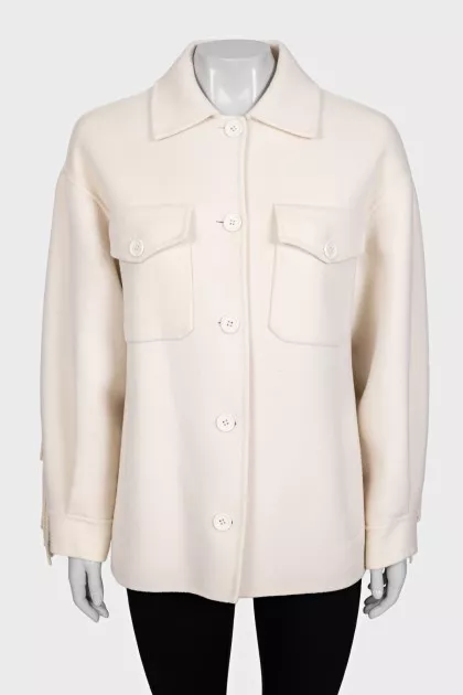 Short wool coat decorated with fringe