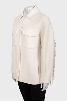 Short wool coat decorated with fringe