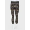 Thin pants with print keys with a tag
