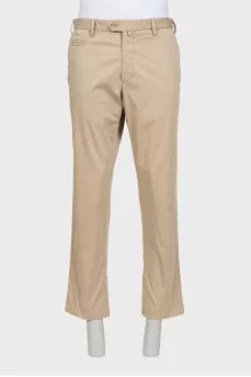 Men's beige trousers with a zipper and buttons