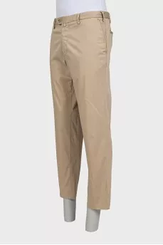 Men's beige trousers with a zipper and buttons