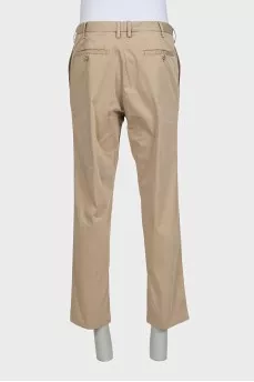 Men's beige trousers with a zipper and buttons