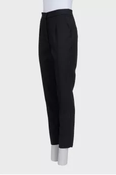 Black straight-leg wool trousers with tag