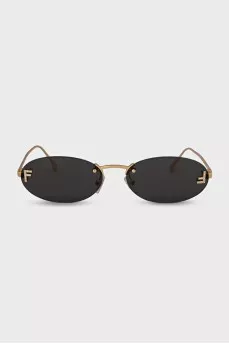 Oval sunglasses with narrow gold temples