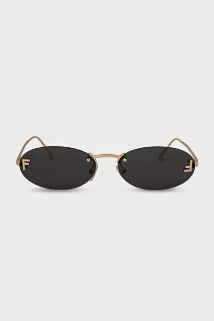 Oval sunglasses with narrow gold temples