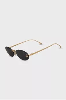 Oval sunglasses with narrow gold temples