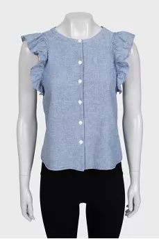 Light blue sleeveless blouse with ruffles