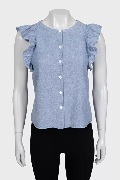 Light blue sleeveless blouse with ruffles